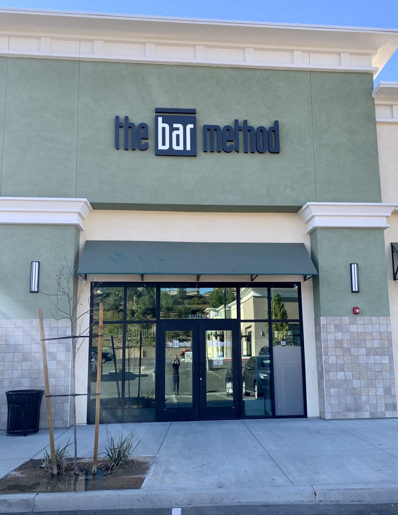 entrance to Bar Method studio, showing exterior signage and front door
