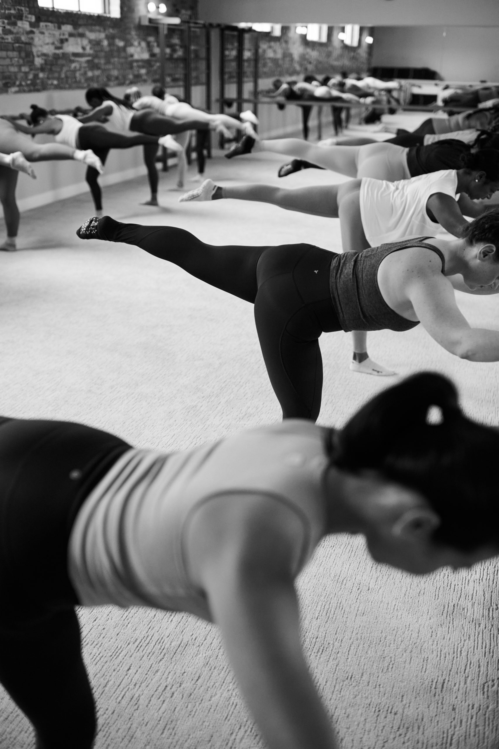 Group of women working out at the barre in Bar Method Studio